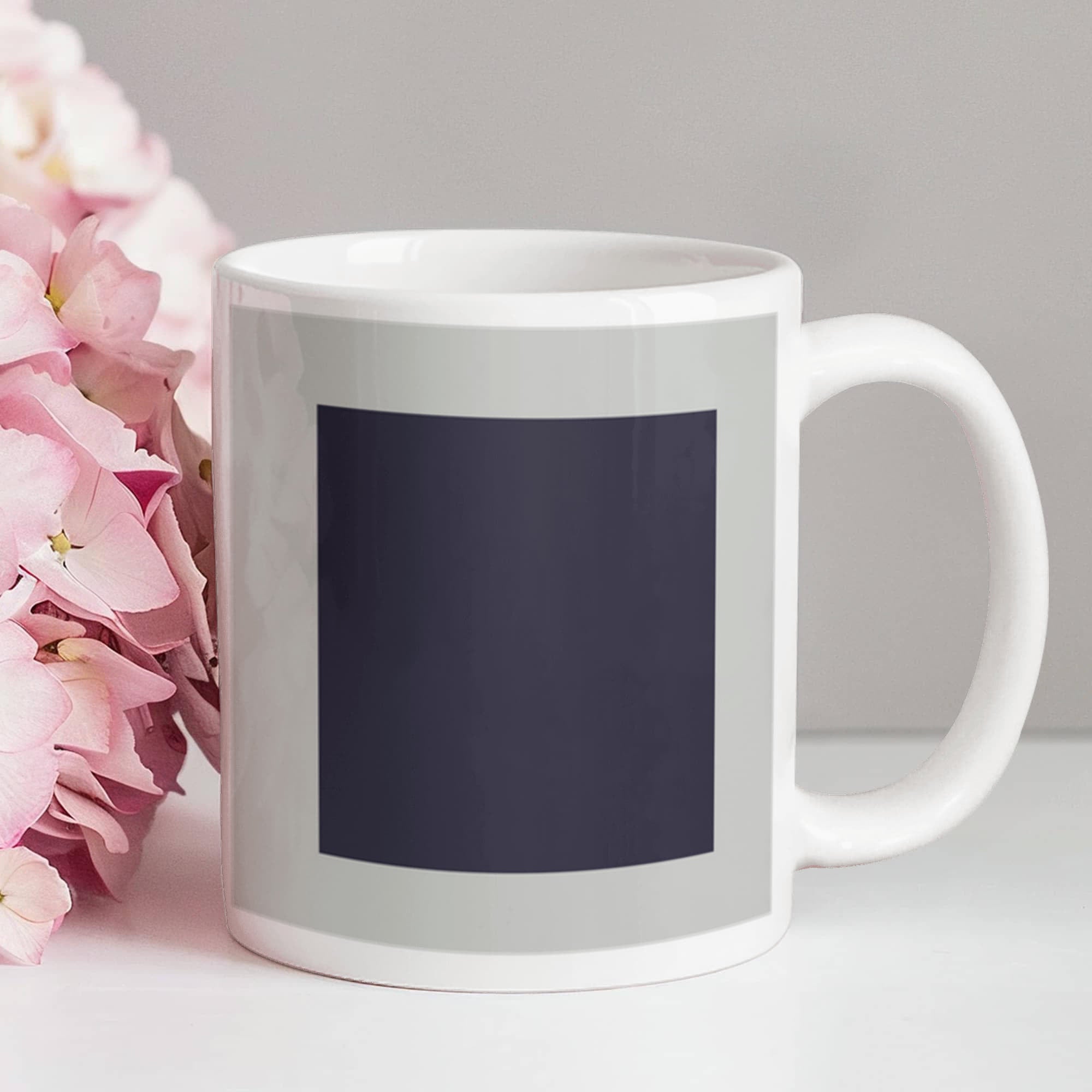 Black Suprematic Square (1915) on a white mug