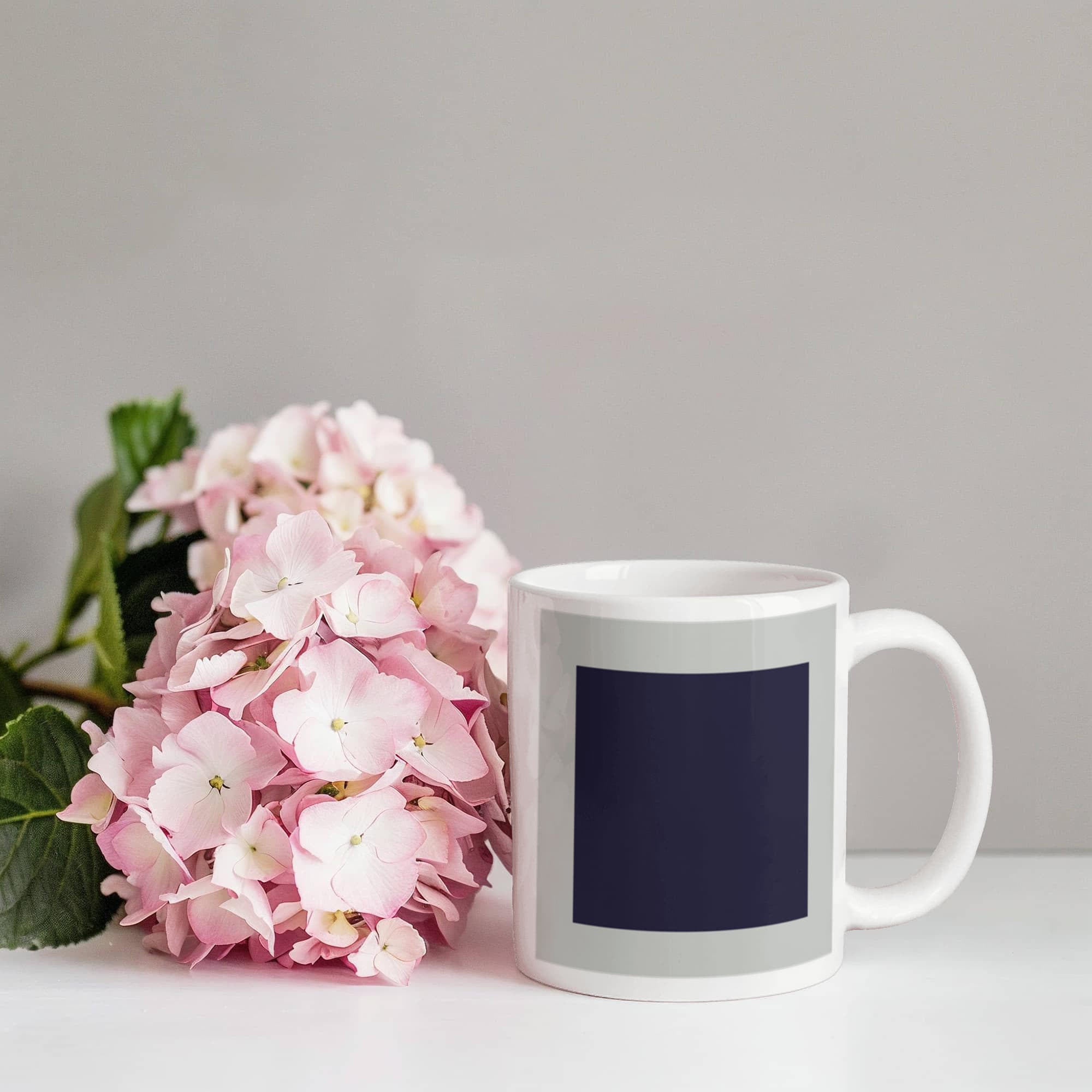 Black Suprematic Square (1915) on a white mug