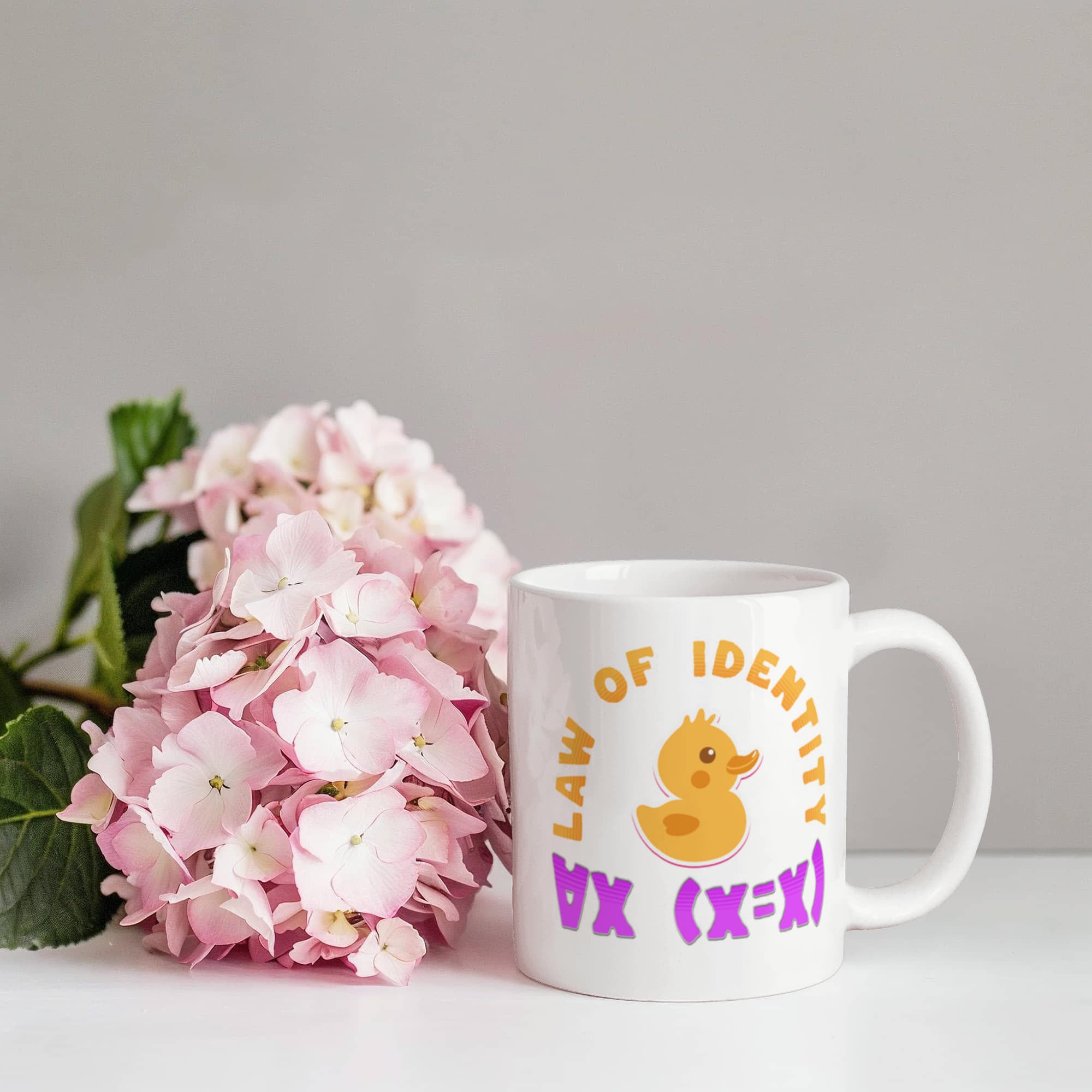 Law of Identity Duckie on a mug